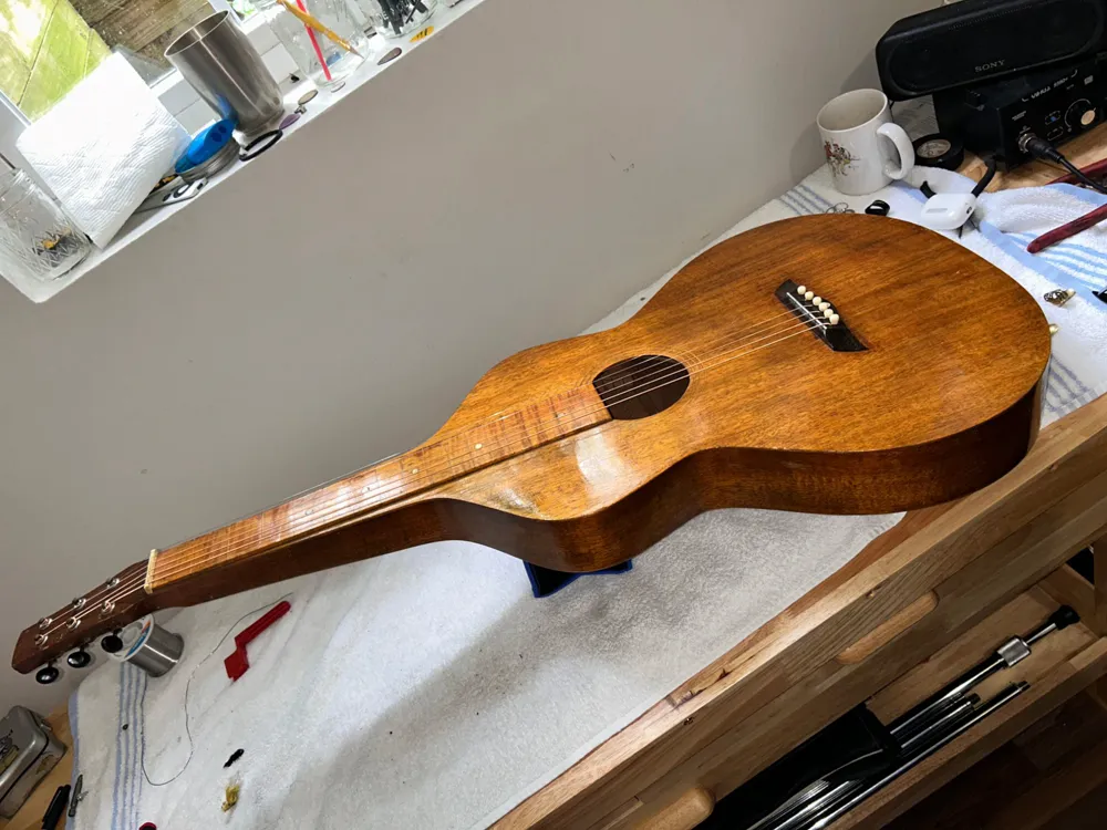 A Weissenborn-style hollow-neck guitar on the workbench